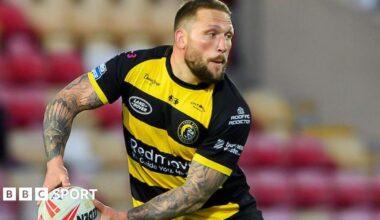 York Knights player Josh Griffin, in yellow and black, about to pass the ball
