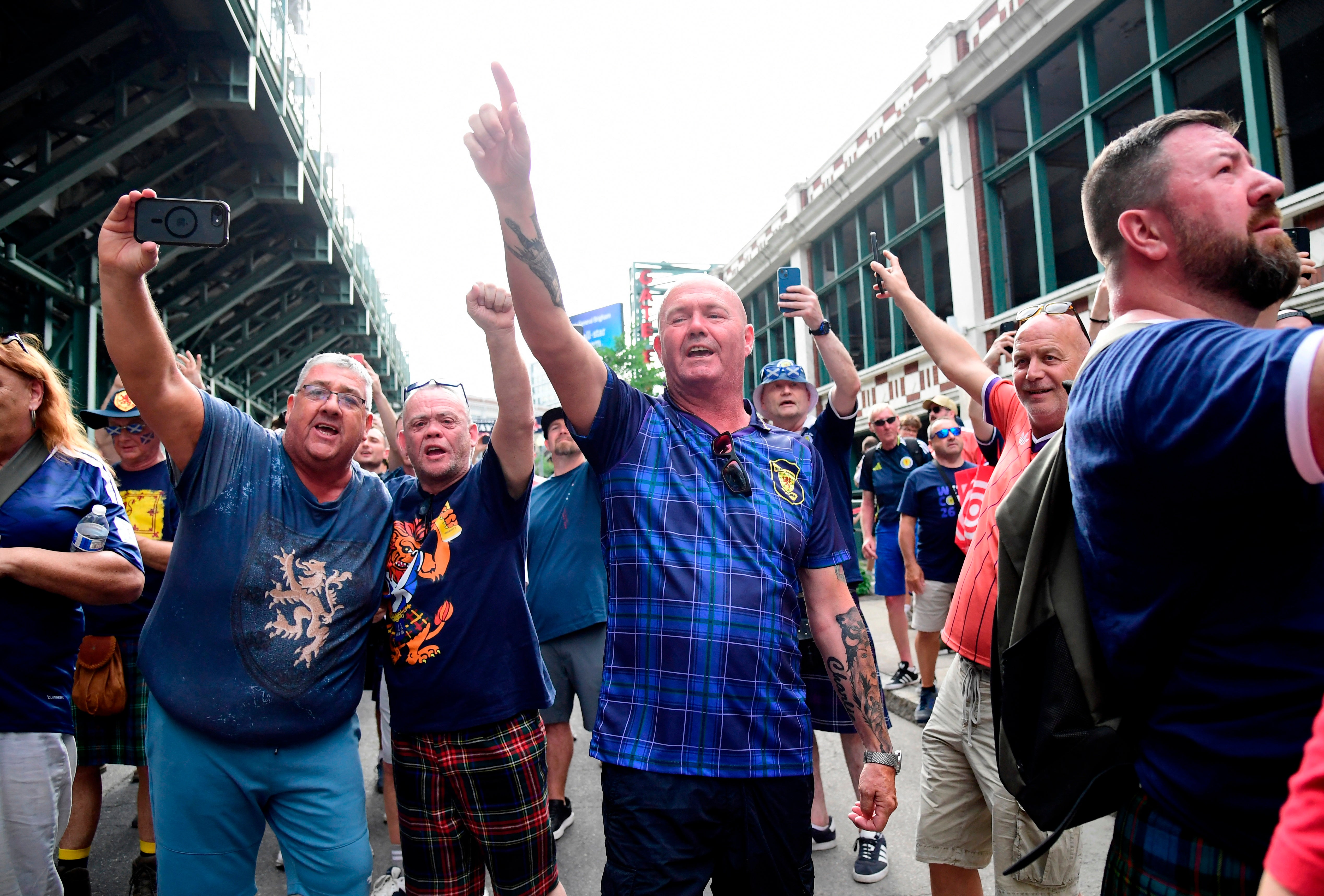 Scotland’s Tartan Army march to Boston’s Fenway Park baseball stadium