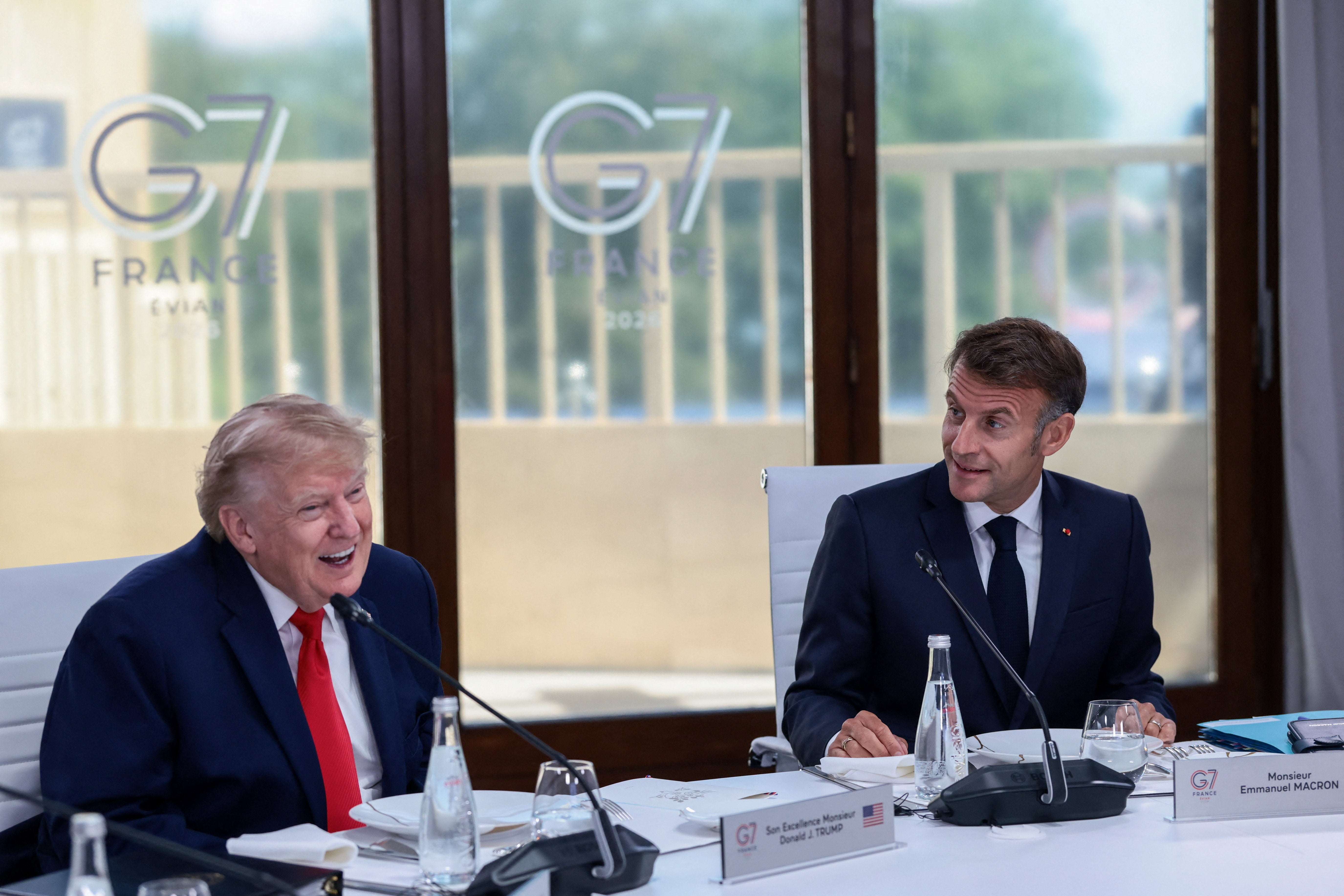 Donald Trump and French President Emmanuel Macron attend a working lunch