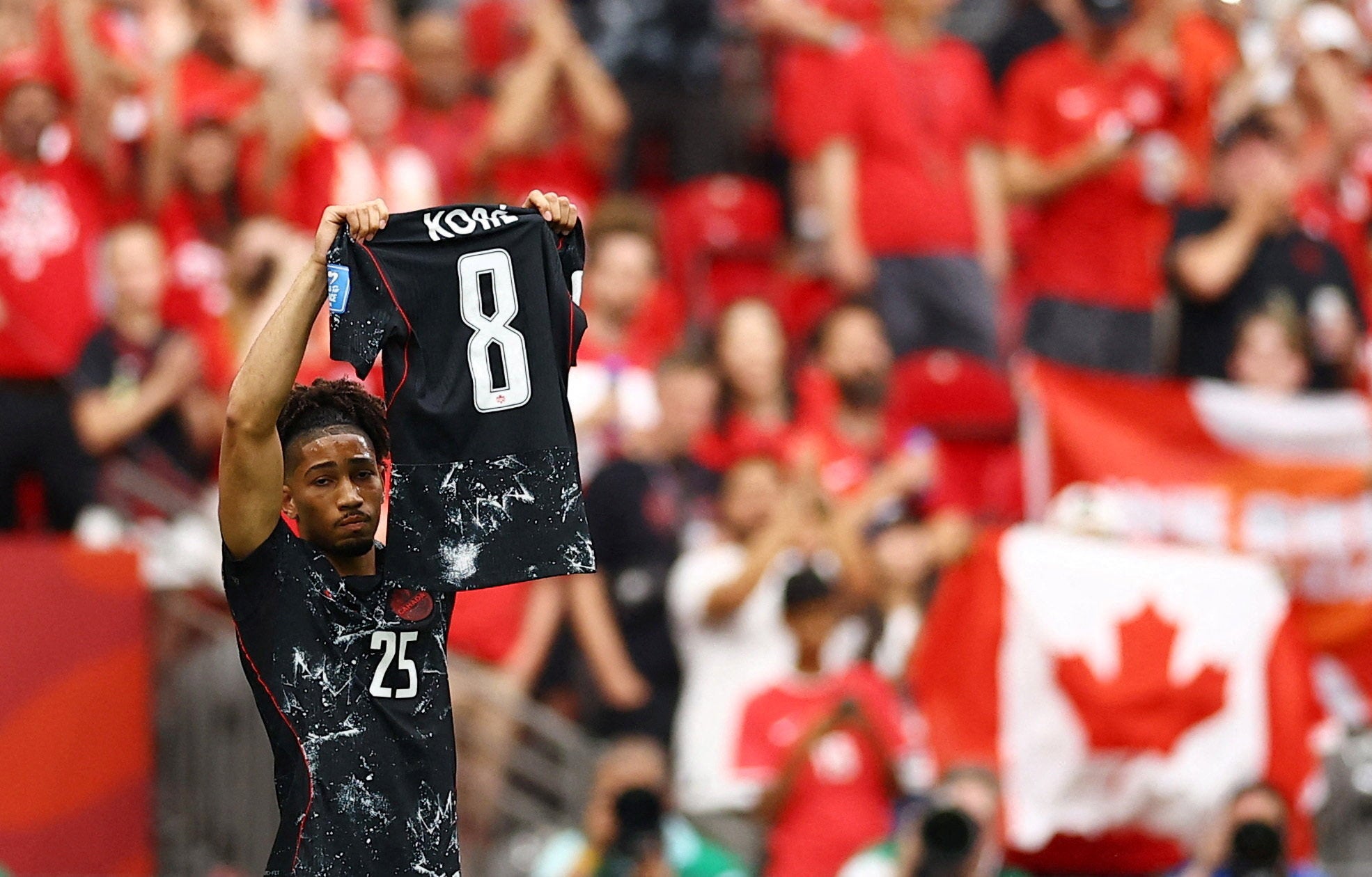 Nathan Saliba raises Ismael Kone's shirt aloft