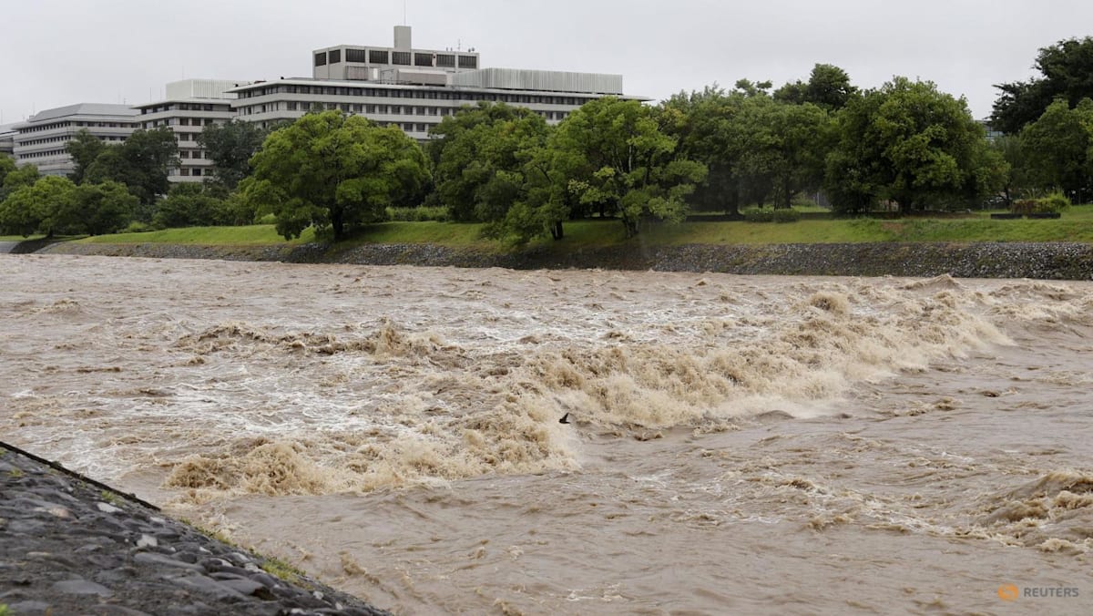 Four injured, flights cancelled in Japan as twin storms approach