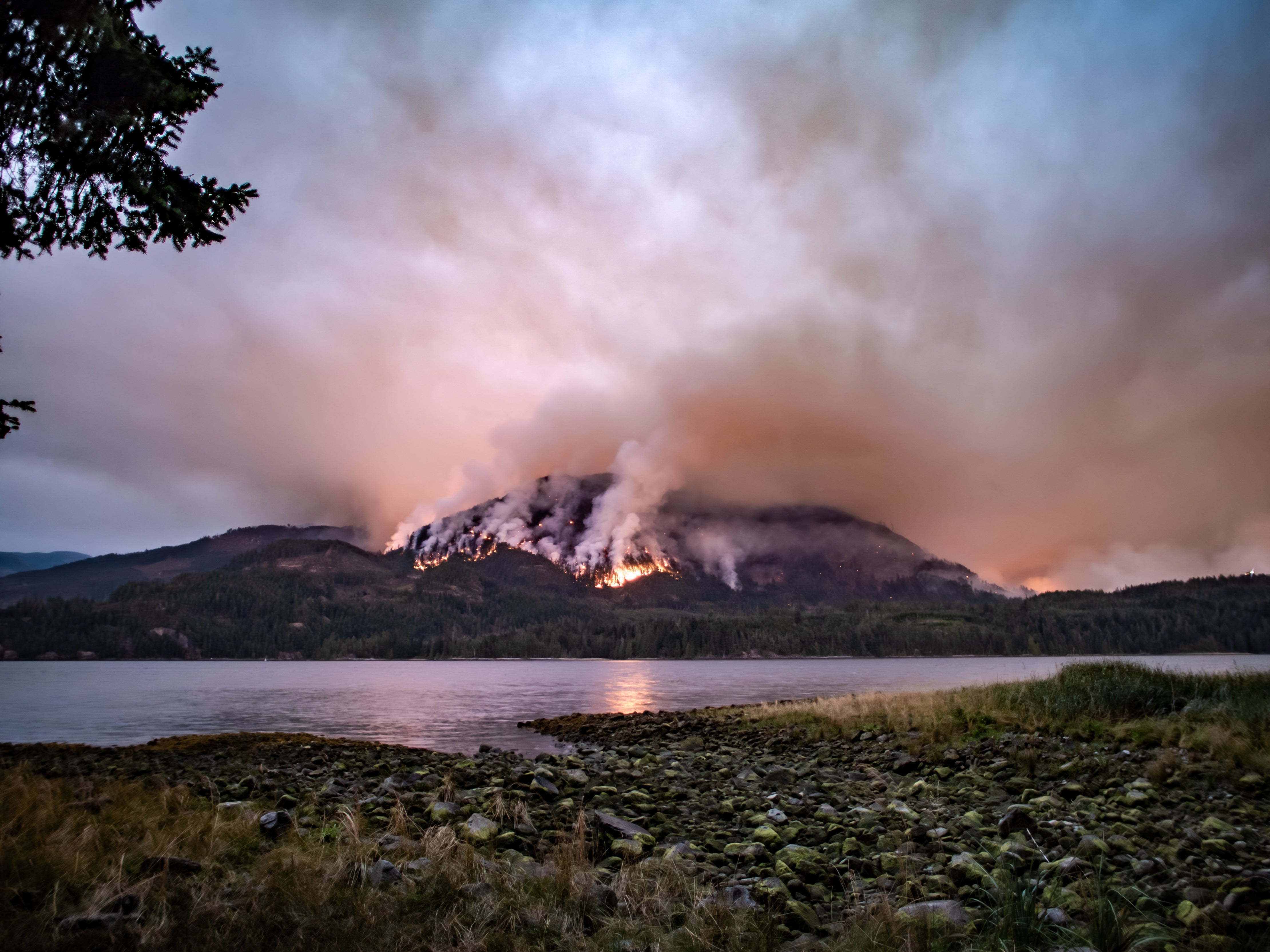 A wildfire burns on Mount Underwood near Port Alberni, on Vancouver Island, British Columbia in 2025
