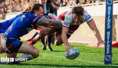 Wigan Warriors winger Noah Hodkinson dives to get the ball down in the corner