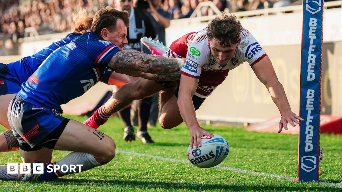 Wigan Warriors winger Noah Hodkinson dives to get the ball down in the corner