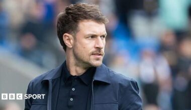 Aaron Ramsey stands on the sidelines as Cardiff City interim head coach