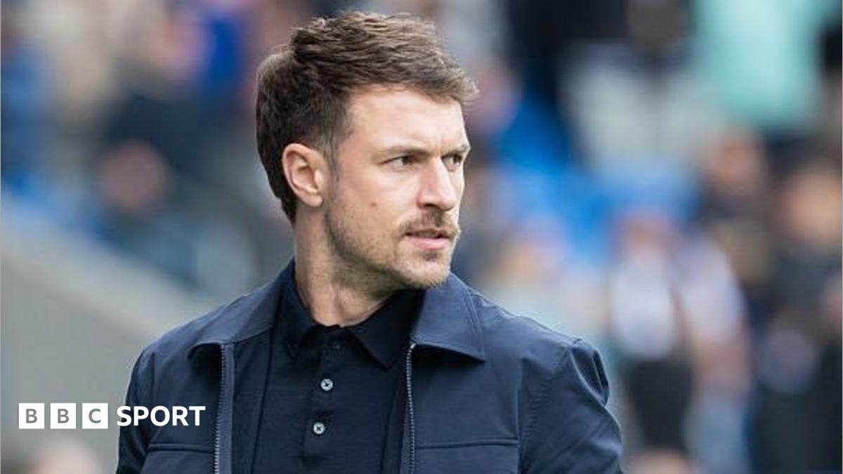 Aaron Ramsey stands on the sidelines as Cardiff City interim head coach