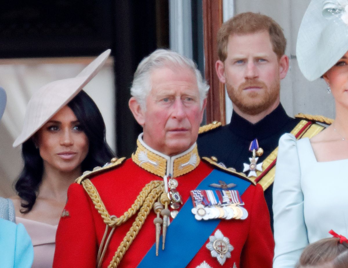 LONDON, UNITED KINGDOM - JUNE 09: (EMBARGOED FOR PUBLICATION IN UK NEWSPAPERS UNTIL 24 HOURS AFTER CREATE DATE AND TIME) Meghan, Duchess of Sussex, Prince Charles, Prince of Wales and Prince Harry, Duke of Sussex stand on the balcony of Buckingham Palace during Trooping The Colour 2018 on June 9, 2018 in London, England. The annual ceremony involving over 1400 guardsmen and cavalry, is believed to have first been performed during the reign of King Charles II. The parade marks the official birthday of the Sovereign, even though the Queen's actual birthday is on April 21st. (Photo by Max Mumby/Indigo/Getty Images)