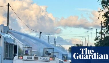 Police use water cannon against rioters in Northern Ireland | UK news