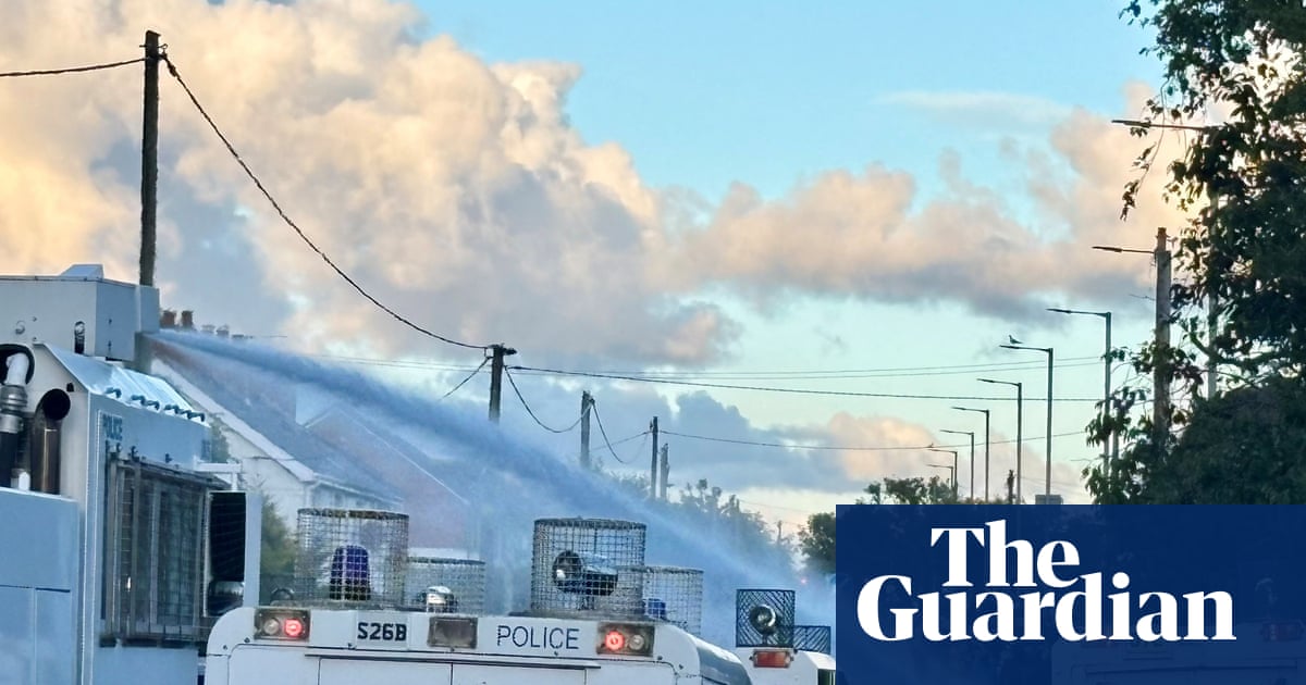 Police use water cannon against rioters in Northern Ireland | UK news