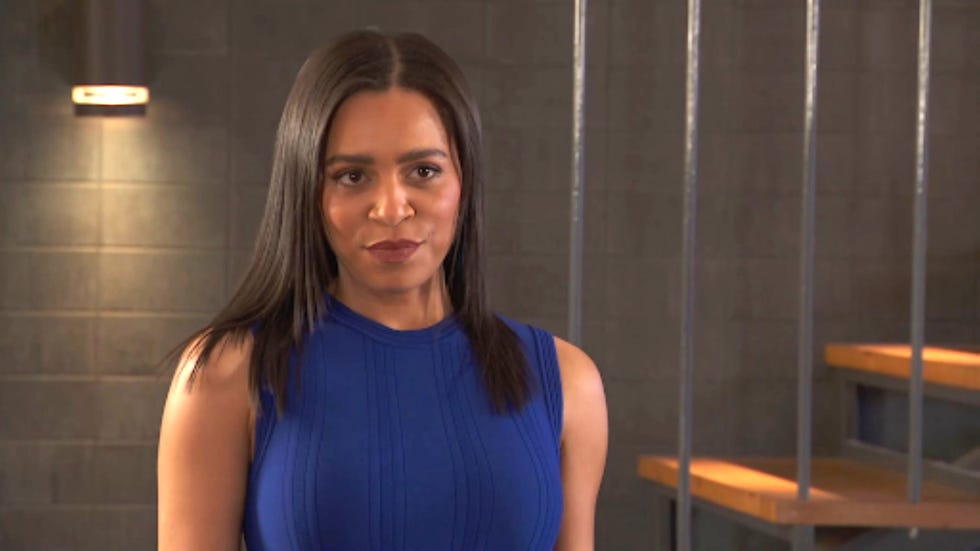 hollyoaks gemma johnson a person wearing a blue sleeveless top in an indoor setting