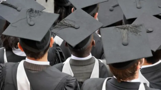 Students wear graduation gown