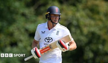Ben McKinney batting for England Lions, with England helmet and England kit on
