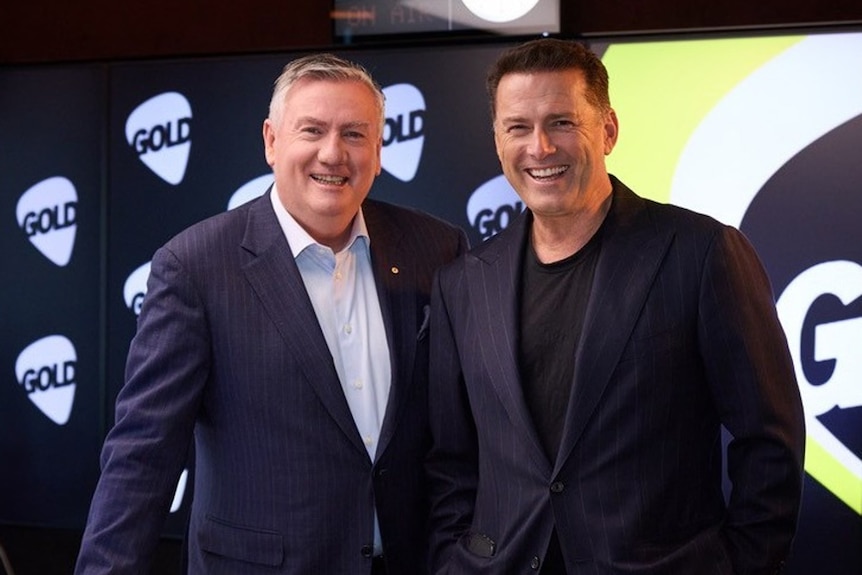 Karl Stefanvoic and Eddie McGuire stand close together, smiling.