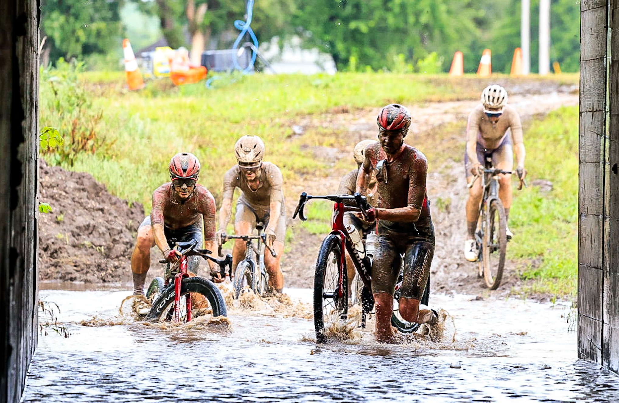 Geerike Schreurs leads the women's breakaway of five riders into a flooded tunnel at 2026 Unbound Gravel