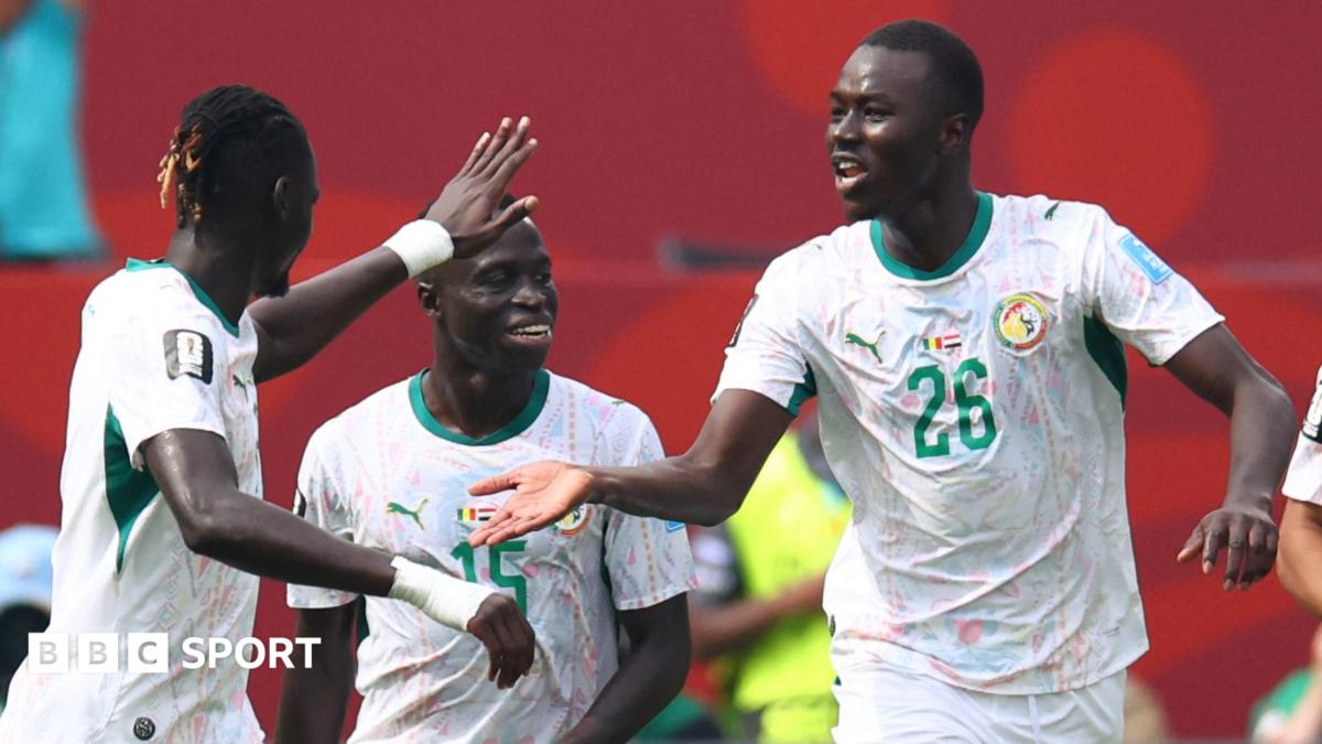 Habib Diarra and Senegal team-mates celebrate their opening goal