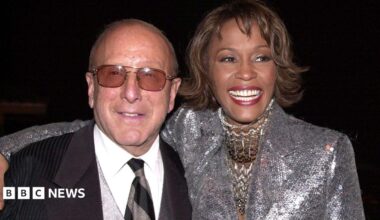 Clive Davis at the Grammys, wearing a black sequinned suit jacket.