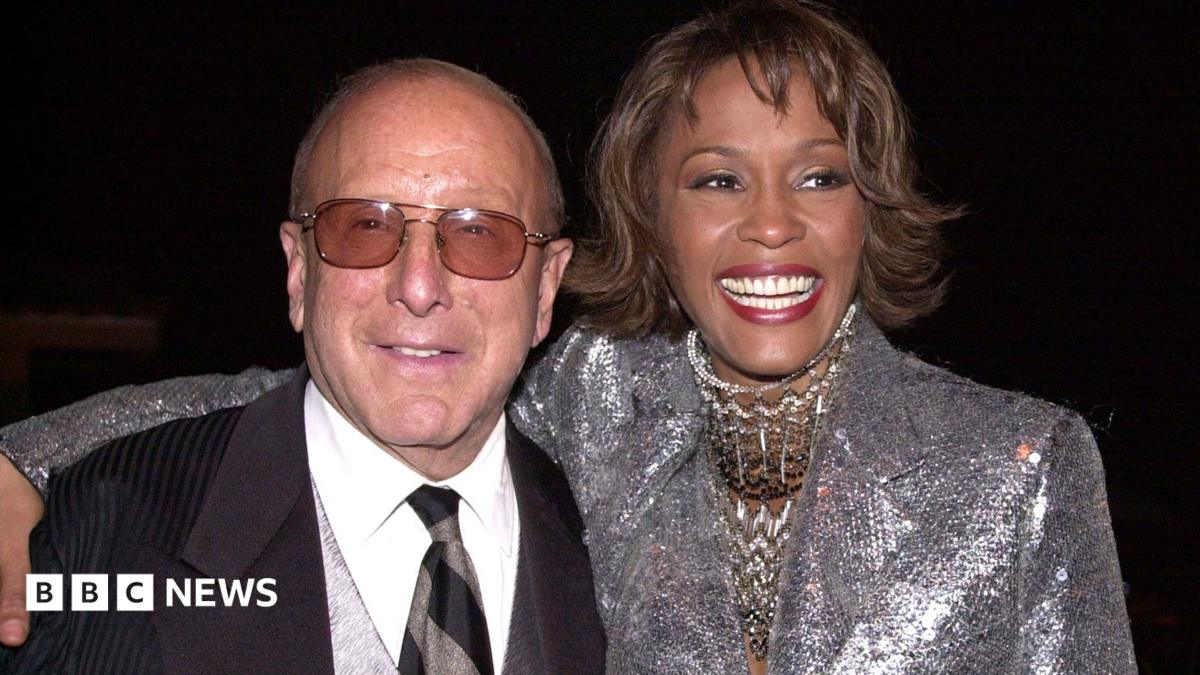 Clive Davis at the Grammys, wearing a black sequinned suit jacket.
