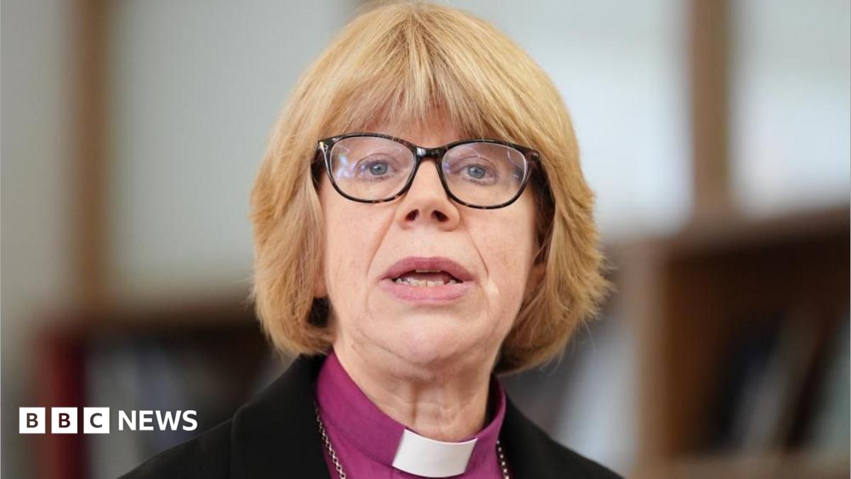 Dame Sarah Mullally, who has a blonde bob hairstyle with a fringe and wears glasses with a dark frame, is pictured speaking at a previous event at Chapter House in Canterbury Cathedral
