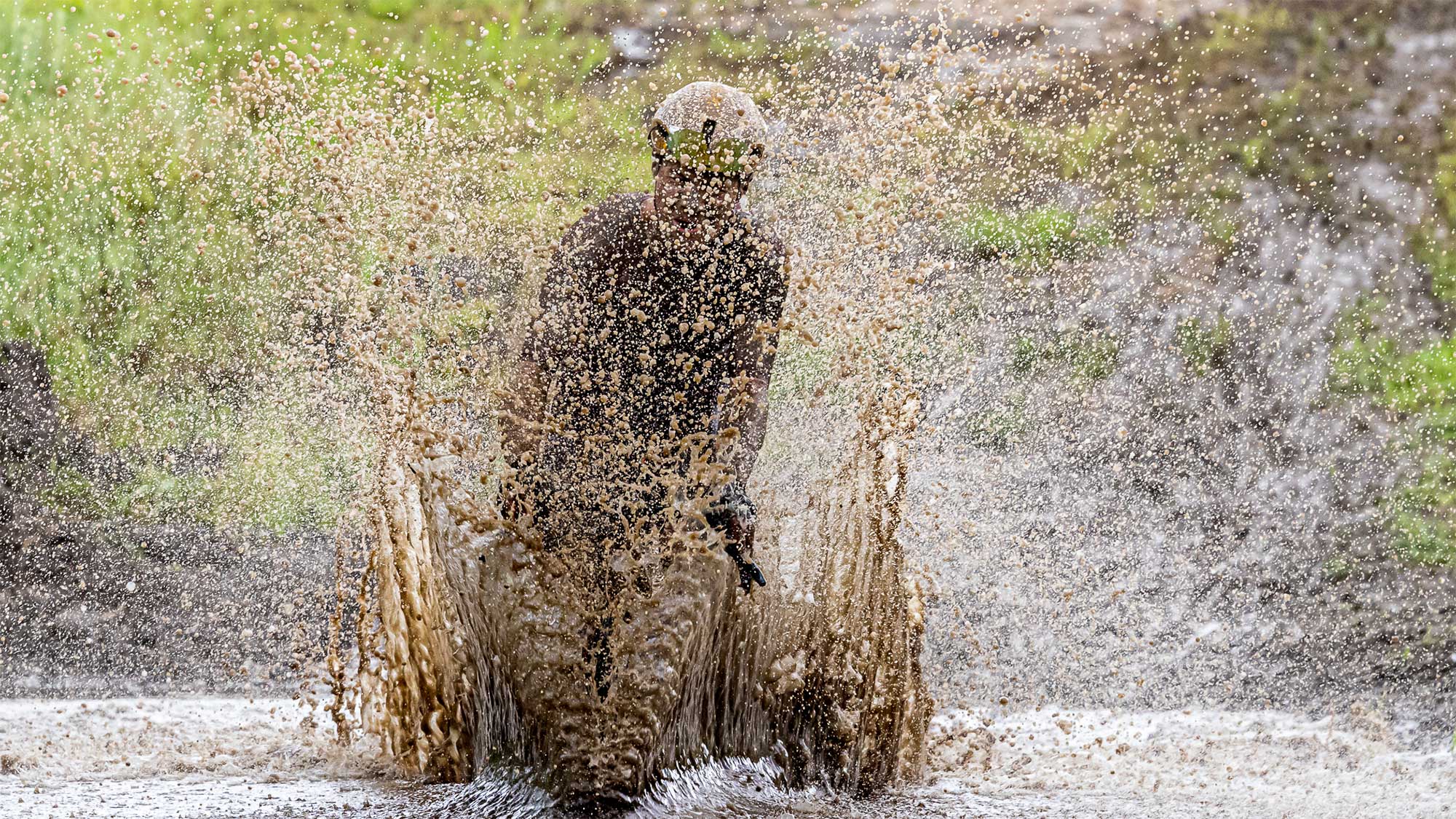 Rider cycles through water at Unbound