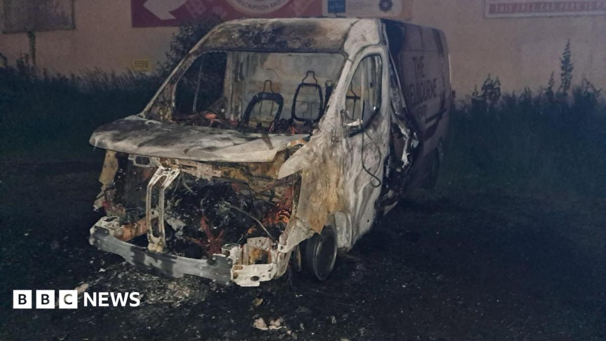 A burnt out van.