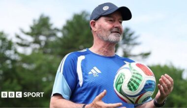 Andy Robertson and Steve Clarke celebrate Scotland's win over Haiti at the World Cup