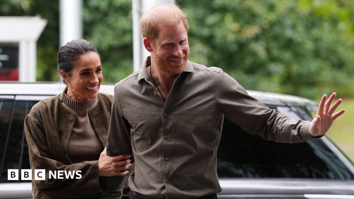 The Duke and Duchess of Sussex wave at the crowd after arriving at an event in Melbourne, Australia on 14 April 2026.