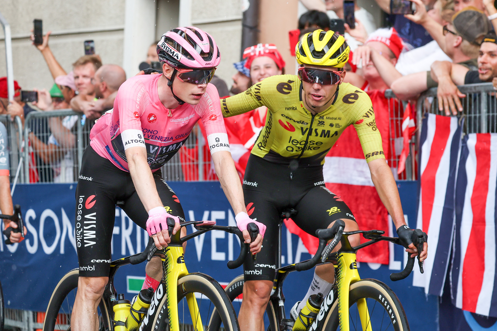 PIEVE DI SOLIGO, ITALY - MAY 28: Jonas Vingegaard of Denmark and Team Visma | Lease a Bike and Pink Leader Jersey crosses the finish line with teammate Davide Piganzoli of Italy during the 109th Giro d'Italia 2026, Stage 18 a 171km stage from Fai della Paganella to Pieve di Soligo on May 28, 2026 in Pieve di Soligo, Italy. (Photo by Sara Cavallini/Getty Images)