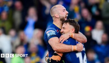 Leeds' Chris Hankinson is congratulated by Jarrod O'Connor on scoring a try against St Helens
