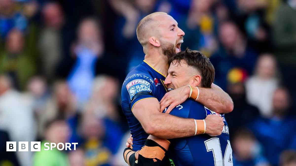 Leeds' Chris Hankinson is congratulated by Jarrod O'Connor on scoring a try against St Helens