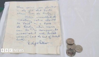 Four coins and a hand-written letter, which says: "These coins were planted in the year that 'Santa Claus' won the Derby. When unearthed, the monetary value should be 'laid on a horse in teh Derby whose name can be in some way associated with 'Santa Claus' (and the best of British luck)