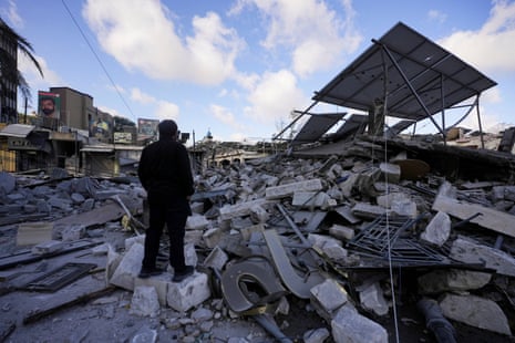 A man inspects the damage in the aftermath of Israeli strikes in Nabatieh, Lebanon, on 15 June 2026.