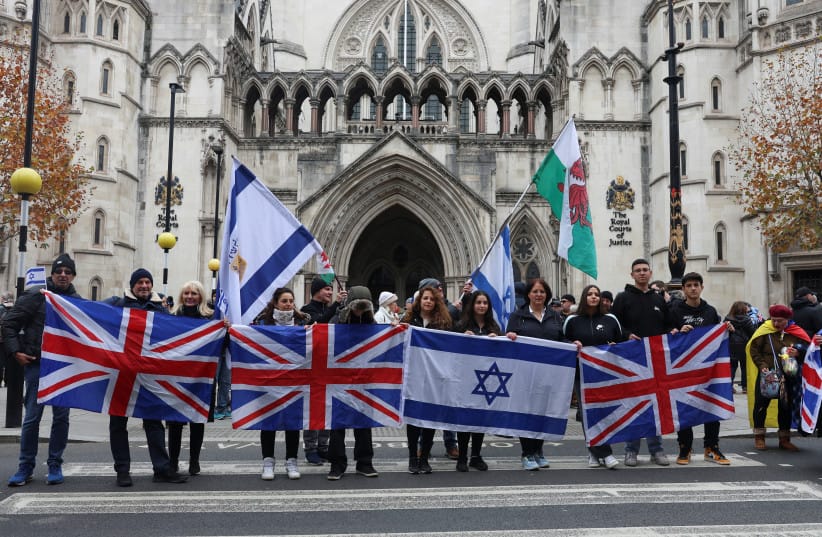 Demonstrators hold Israeli and British flags outside the Law Courts, during a march against antisemitism, after an increase in the UK, during a temporary truce between the Palestinian Islamist group Hamas and Israel, in London, Britain November 26, 2023.