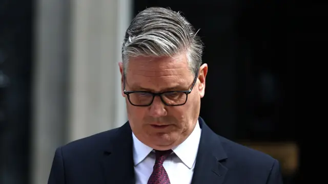 Keir Starmer looks down as he announces his resignation on the steps of Downing Street