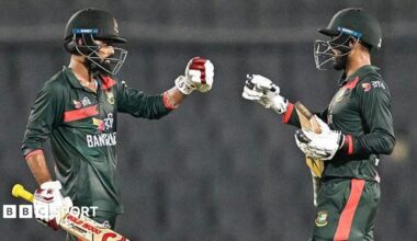 Bangladesh's Towhid Hridoy (L) and captain Mehidy Hasan Miraz (C) celebrate their team's win at the end of the second one-day international (ODI) cricket match between Bangladesh and Australia at the Sher-e-Bangla National Stadium in Dhaka