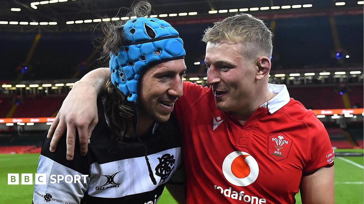 Wales' Leigh Halfpenny and Barbarians' Alun Wyn Jones embrace in Cardiff