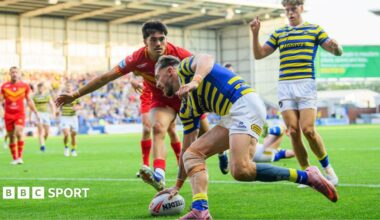 Matty Ashton touches the ball down for a try for Warrington as the Catalans defence arrives too late.