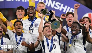 James McAtee lifts the Euro 2025 trophy with the England Under-21s