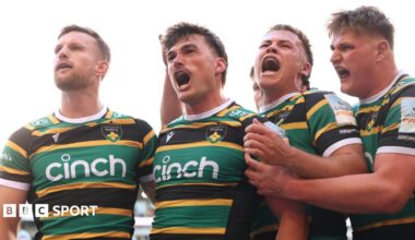 George Furbank (centre) celebrates scoring a try for Northampton against Leicester in the Prem semi-final