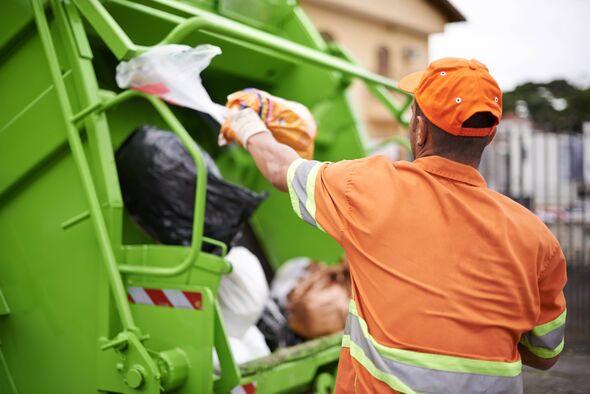Cropped shot of a garbage collection worker Cropped shot of a garbage collection worker