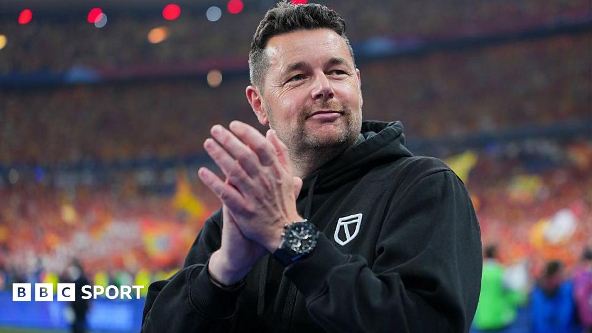 Pierre Sage, wearing a black hoodie while in charge of Lens, claps at the end of a game