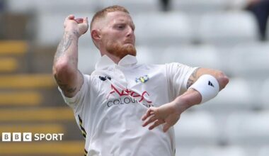 Ben Stokes in a white Durham shirt bowling