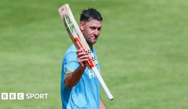Warwickshire Bears all-rounder Beau Webster raises his bat to the crowd during the match with Northamptonshire