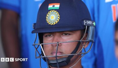 Vaibhav Sooryavanshi wearing an India helmet waiting to bat
