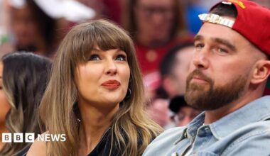 Singer Taylor Swift tilts her head up while sitting next to fiance Travis Kelce of the Kansas City Chiefs at Game Three between the New York Knicks and the Cleveland Cavaliers in the NBA Eastern Conference Finals.