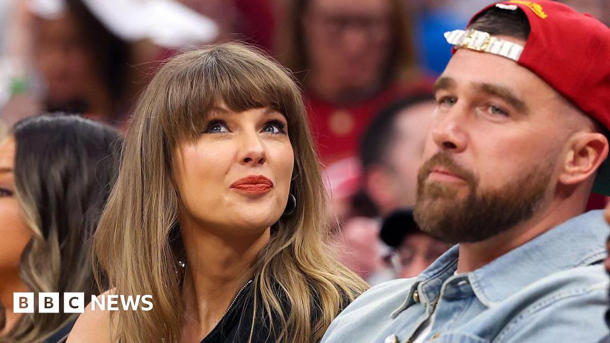 Singer Taylor Swift tilts her head up while sitting next to fiance Travis Kelce of the Kansas City Chiefs at Game Three between the New York Knicks and the Cleveland Cavaliers in the NBA Eastern Conference Finals.
