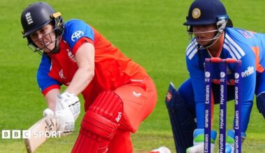 Nat Sciver-Brunt plays a sweep shot as India wicketkeeper Richa Ghosh watches on