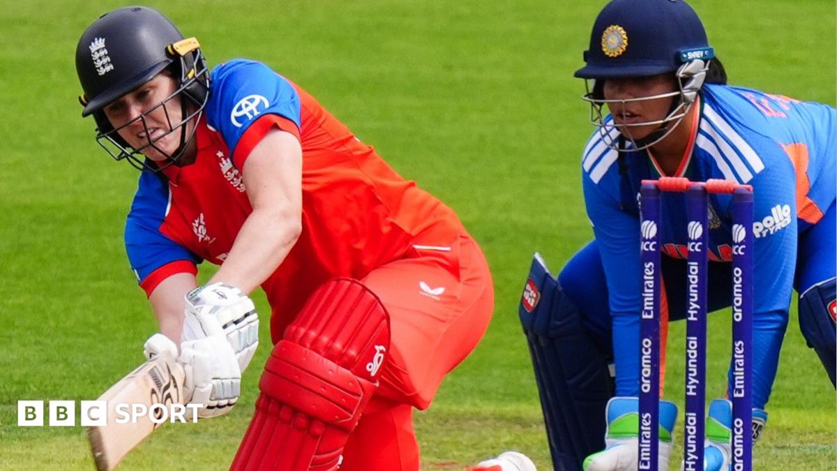 Nat Sciver-Brunt plays a sweep shot as India wicketkeeper Richa Ghosh watches on
