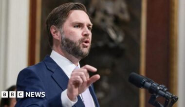 JD Vance speaking into a microphone.