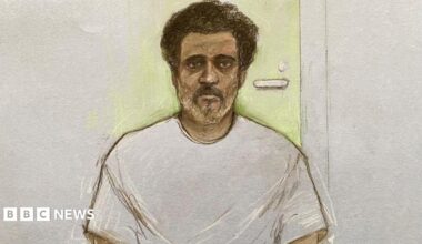 Court artist drawing of Ajay Pant, wearing a grey t-shirt sat in front of a bright door