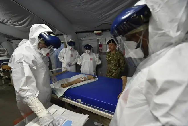 NHS staff training to combat Ebola in Sierra Leone, 2014. The World Health Organisation (WHO) has designated the current outbreak in Africa a Public Health Emergency of International Concern.